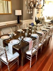 Beautiful farmhouse table by Presentime Rentals and mix matched china by The Prissy Plate Company. Florals by In An Instant, LLC. 
